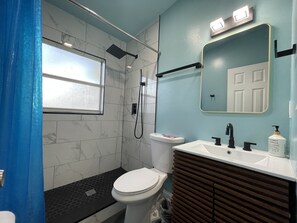 Bathtub, hair dryer, towels, soap