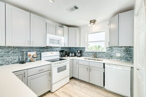 Fridge, microwave, oven, stovetop - Updated Beachfront Home w/ Panoramic Gulf Views, Open Plan - Steps from Sand (Galveston)