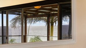 A room with a view of the ocean through a window with a wooden frame and a glass panel. - MAGICAL VIEWS OF DEE WHY (Dee Why)