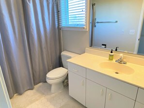 Combined shower/tub, hair dryer, towels, soap