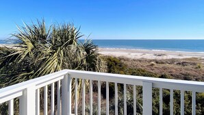 A balcony with a view of a beach and ocean. - Beach Club Villa 29 by Deserving Vacations (Isle of Palms)
