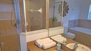 Combined shower/tub, hair dryer, towels, soap