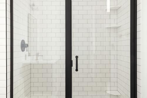 Combined shower/tub, designer toiletries, hair dryer, towels