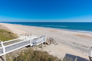 A beach with a wooden walkway leading to the shore. - Vitamin Sea - Oceanfront, 5 BR Home in Surf City - Elevator! (Surf City)