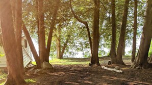 A campsite with tents and trees. - Lakeview Scenic Cabin sleep 4 (Mar)