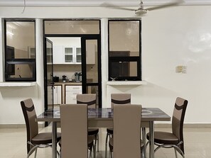 Enjoy meals in this stylish dining area with a large table and six comfortable chairs.