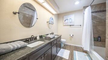 Combined shower/bathtub, hair dryer, towels, soap