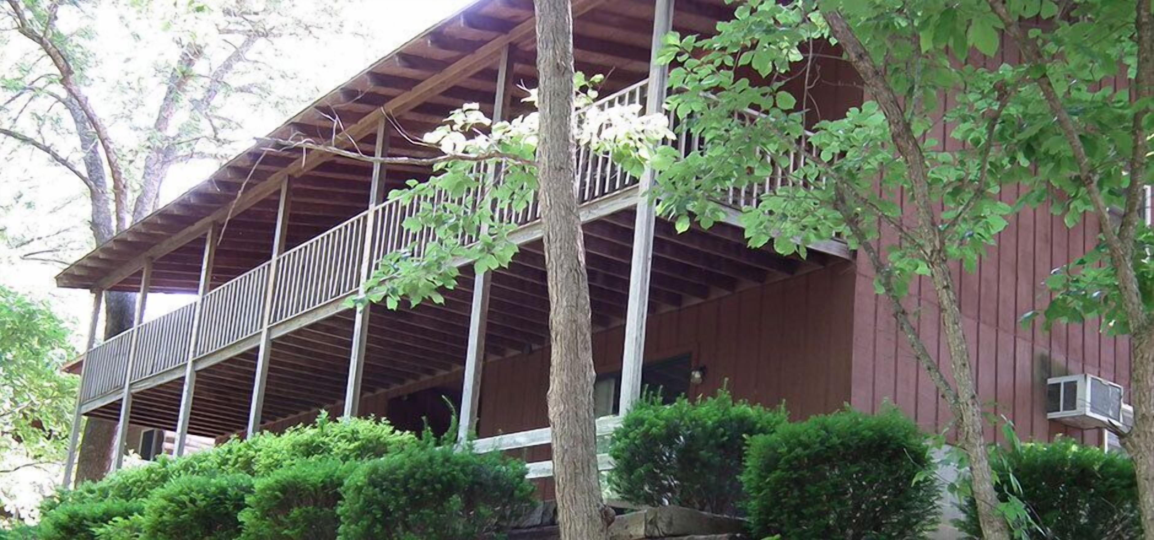 A wooden building with a balcony.