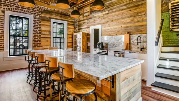 A spacious kitchen with a large island, wooden accents, and modern appliances. - Downtown+FREE Parking+Walk Everywhere+Forsyth Park (Savannah)