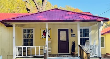 Downtown by Chattahoochee River, sit on front porch as horse and buggy stroll by