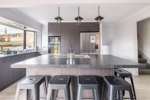 Microwave, oven, stovetop, dishwasher - The Hiltons | Two Houses, One Site with Spa Pools (Rotorua)