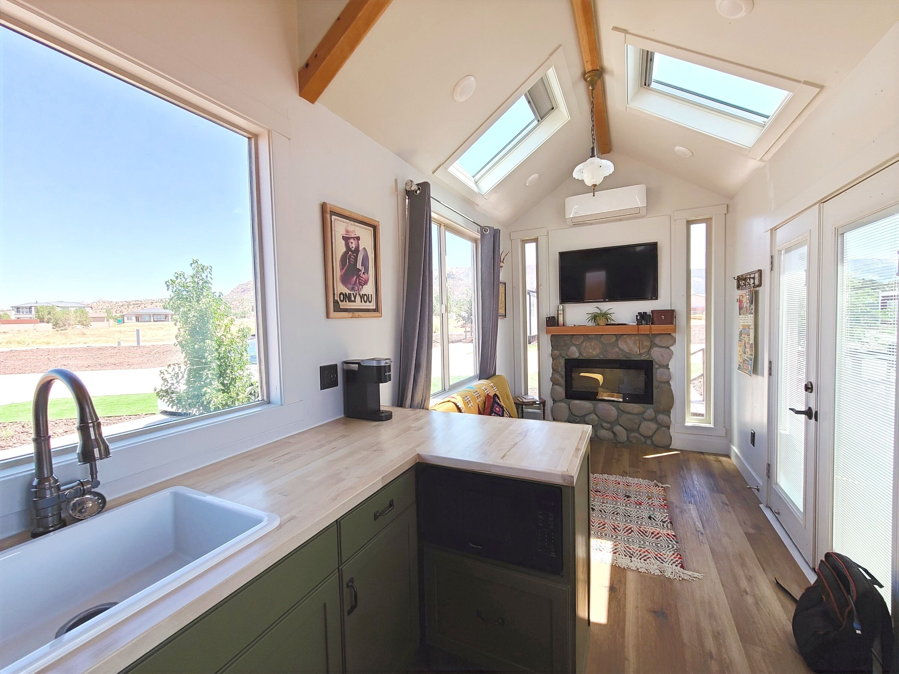 Fridge, microwave, coffee/tea maker, cookware/dishes/utensils