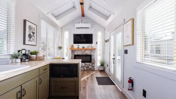 Fridge, microwave, coffee/tea maker, cookware/dishes/utensils