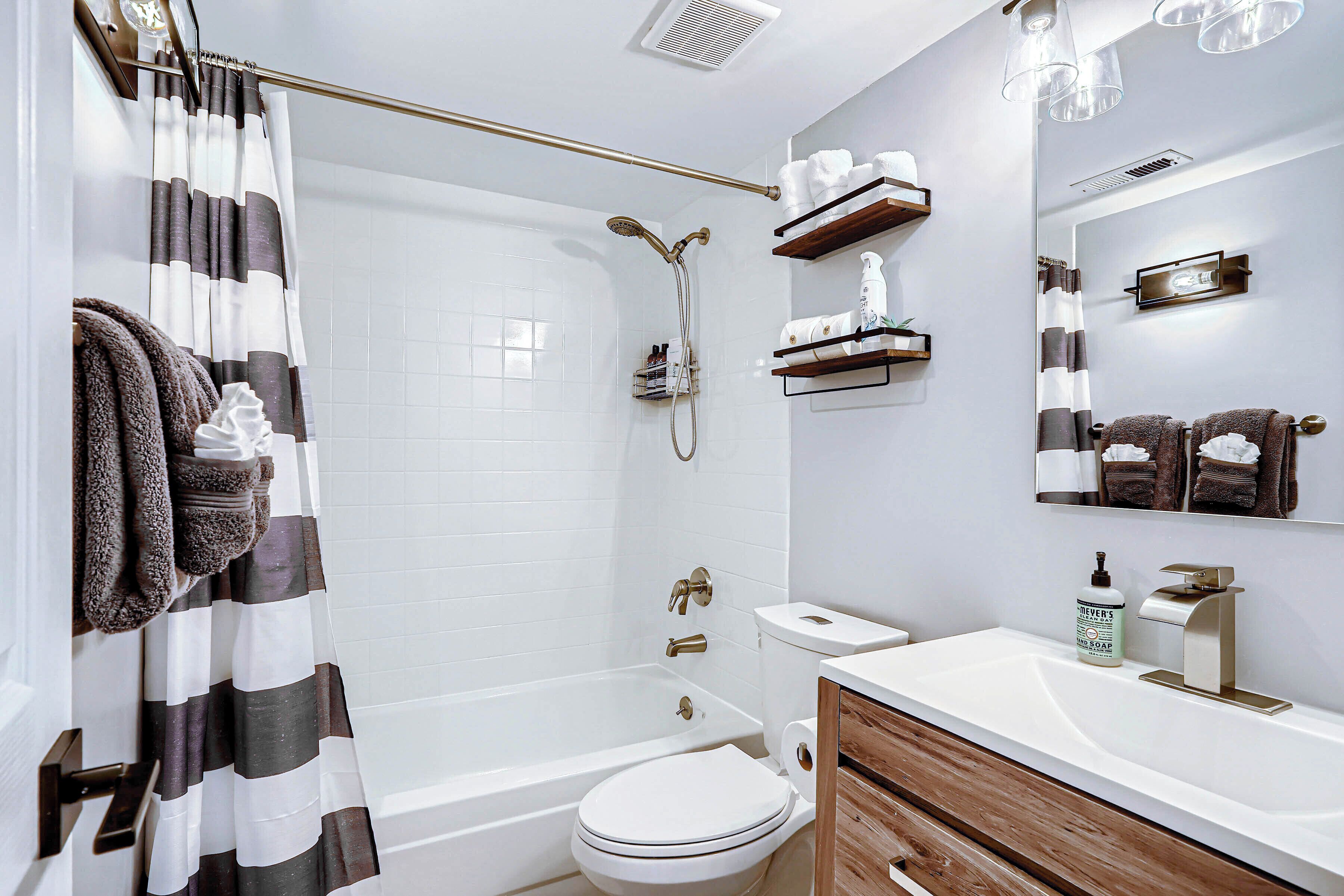 Combined shower/tub, hair dryer, towels, soap