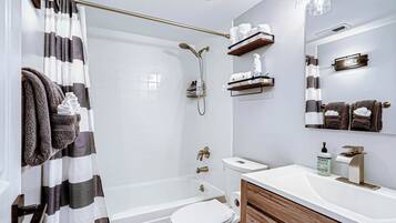 Combined shower/tub, hair dryer, towels, soap