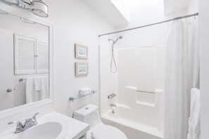 Combined shower/bathtub, hair dryer, towels, soap