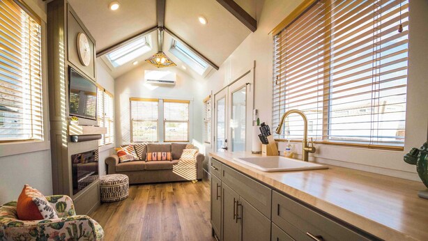 A modern kitchen with a wooden countertop, a built-in oven, and a window with blinds. - Zion-Day-Trip Ready • Tiny Home + Mountain Views (Apple Valley)