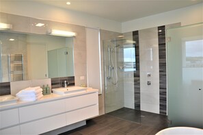 Bathtub, hair dryer, towels, soap