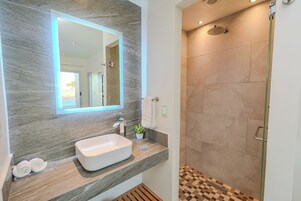 Shower, rainfall showerhead, designer toiletries, hair dryer