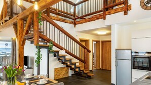A modern kitchen with a built-in oven and a refrigerator. - Holiday flat "Landhaus Ameisberg" with mountain view, garden and Wifi (Mitternschlag)