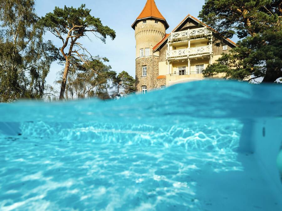 Seasonal outdoor pool, open 10:00 AM to 9:00 PM, pool umbrellas