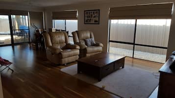Family House | Living area | 50-inch flat-screen TV with digital channels, TV, DVD player