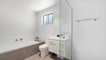 Bathtub, hair dryer, towels, soap