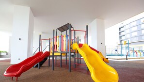 A playground with two slides, a climbing structure, and a water feature. - NOVO 8 Jonker Street Melaka By I Housing (Malacca City)