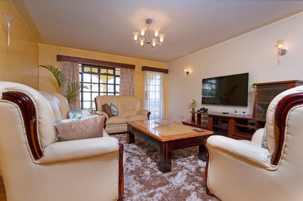 Apartment, 3 Bedrooms | Living area | Flat-screen TV - Bamboo Suites by Edmor suites (Nairobi)
