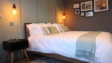 1 bedroom, desk, iron/ironing board, travel crib