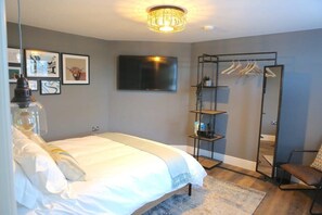 1 bedroom, desk, iron/ironing board, travel crib