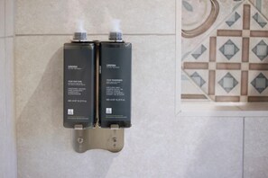 Shower, hair dryer, towels, shampoo