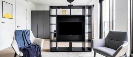 Apartment (0 Bedroom) | Living area | 24-inch Smart TV with cable channels, TV, heated floors
