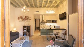 Exclusive Apartment | Living area | 40-inch flat-screen TV with cable channels, TV