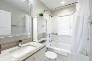 Bathtub, hair dryer, towels