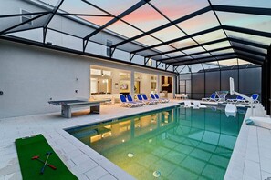 A heated pool, pool loungers