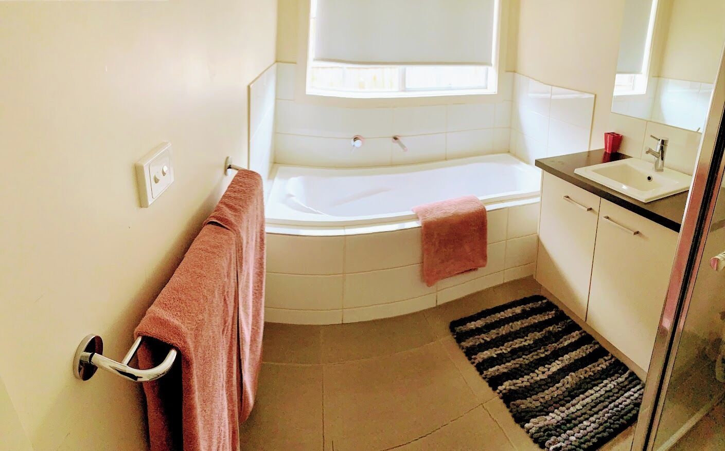 Bathtub, hair dryer, towels, soap