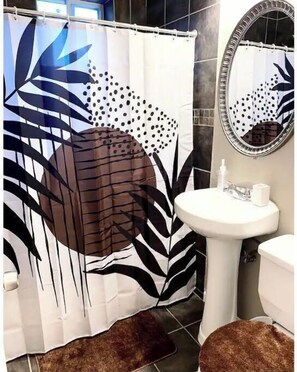 Combined shower/tub, hair dryer, towels, soap