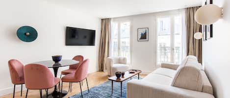 Deluxe Apartment, 1 Queen Bed with Sofa bed, Balcony, City View | Living area | Smart TV, printers