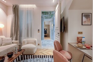 Apartamento superior | Zona de estar | Una Smart TV, una impresora