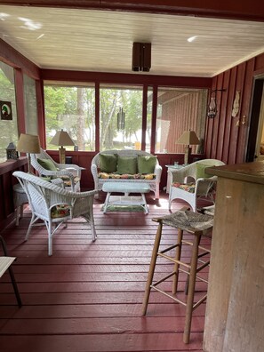 Screened-in porch with bar