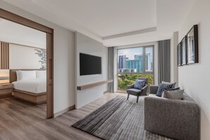 Executive Suite, 1 King Bed, City View | Living room | 55-inch LED TV with cable channels, TV