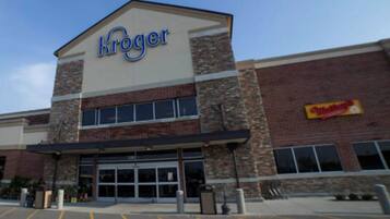 A Kroger store with a brick facade and large windows.