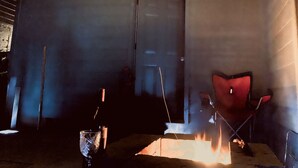 A room with a fireplace, a door, and a red chair. - Private getaway in a beautiful neighborhood (Salem)