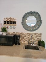 Fridge, microwave, coffee/tea maker, toaster