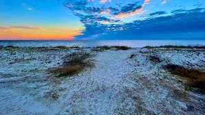 A beach path leading to the ocean with a clear sky and clouds. - 5 Bedroom Beach House Slps 12 - Private Beach - Shells - Fishing -Screened porch (Panacea)
