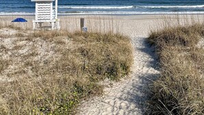 A beach path leading to a lifeguard tower with a clear view of the ocean. - Modern Beach Home with Golf Cart! Dog Friendly! (Carolina Beach)