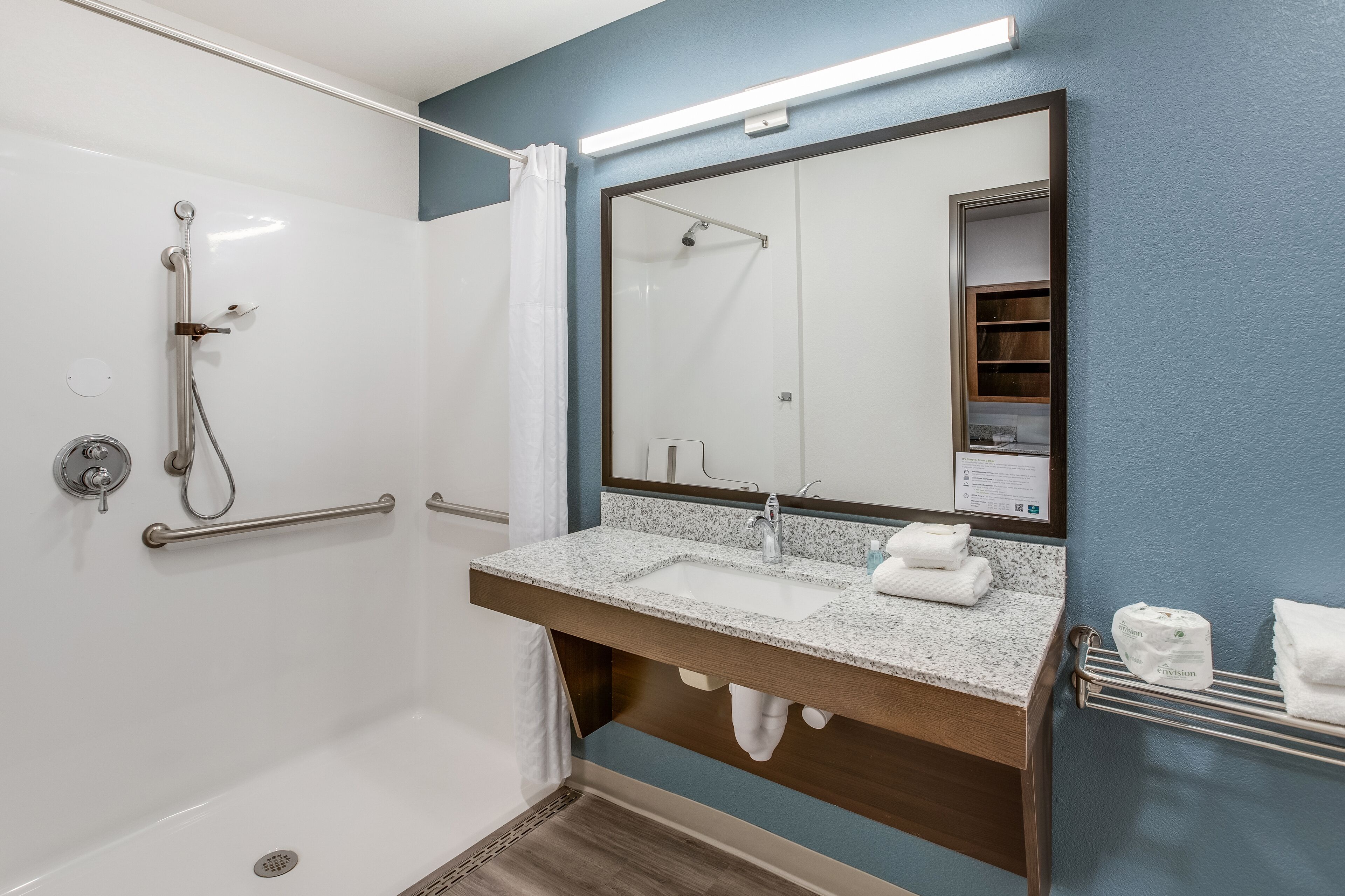 Queen Suite Accessible Roll-in Shower | Bathroom | Hair dryer, towels