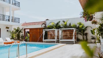 Outdoor pool, open 10:00 AM to 10:00 PM, free pool cabanas