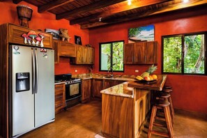 Fridge, stovetop, dishwasher, coffee/tea maker